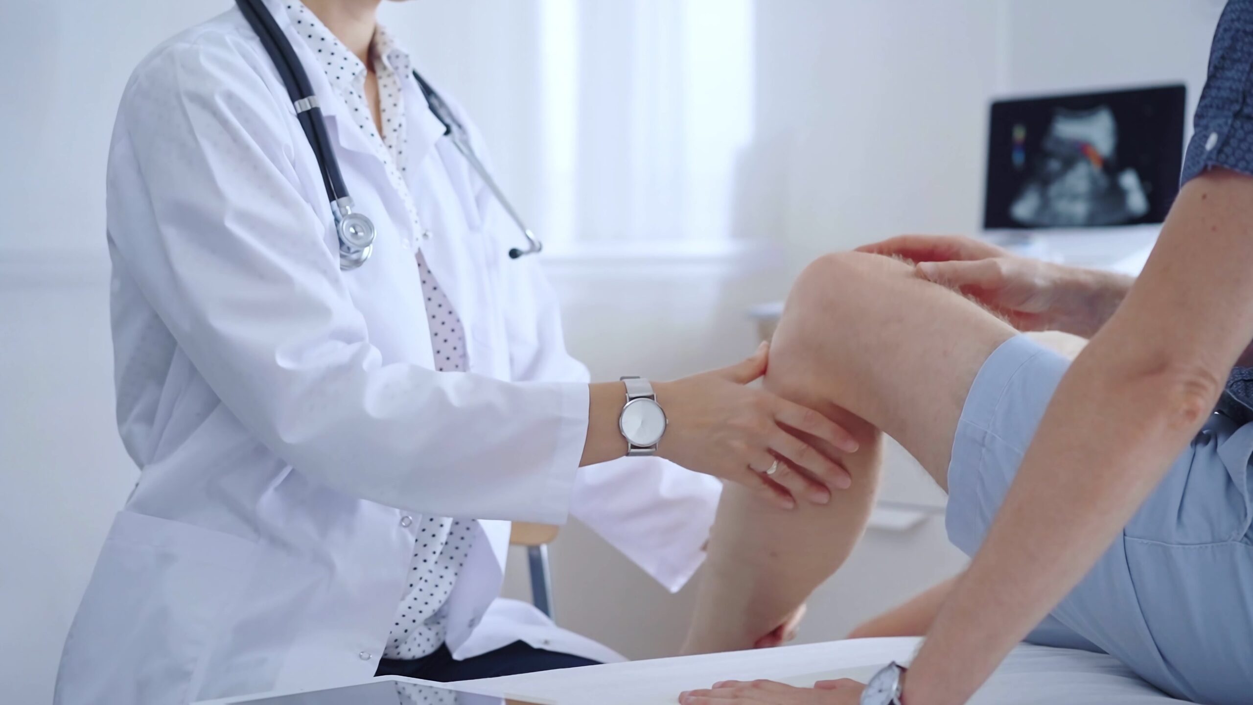 Doctor is carefully examining a patient's knee, providing personalized care and support. Medicine and orthopedic concept