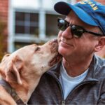 Middle aged man with his emotional support animal