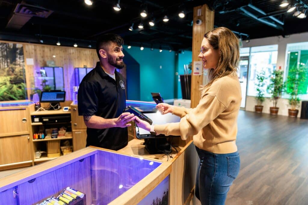 A patient purchases products at a licensed dispensary.